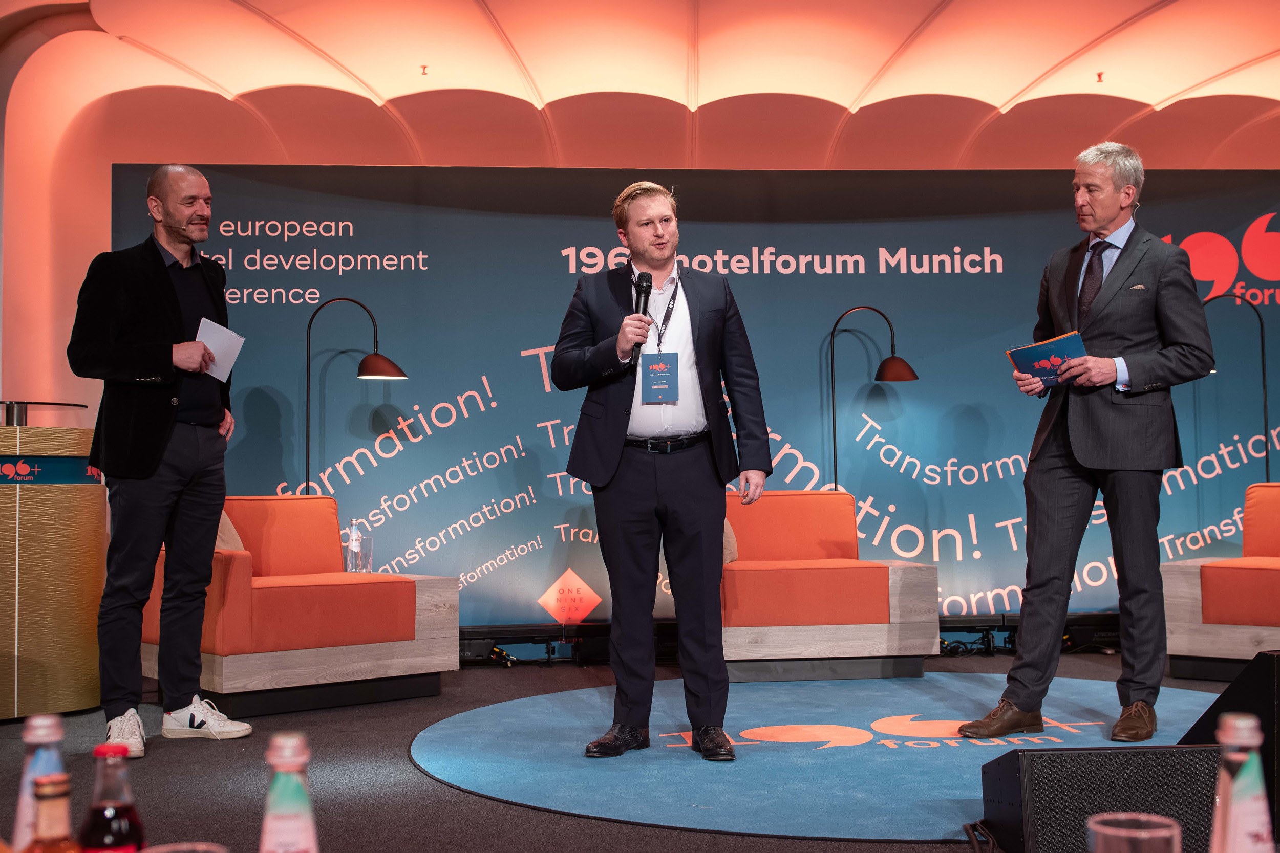 Matthias presenting on stage at hotelforum Munich for the Hospitality UPGRADE Award 2020
